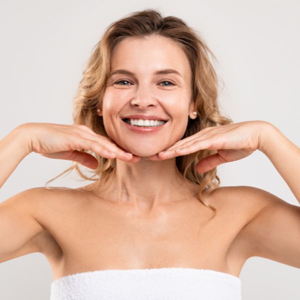 Beautiful woman with radiant skin promoting Plasma Pen treatment at Admire Aesthetics in Medford and Grants Pass, OR
