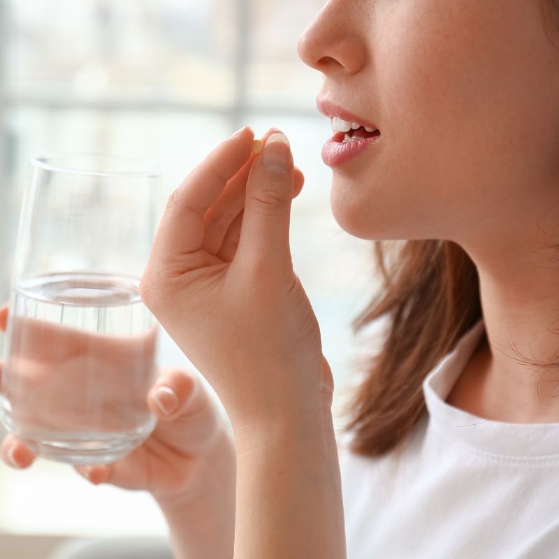 someone taking a vitamin