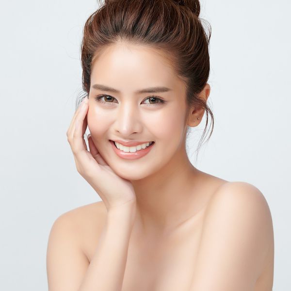 A beautiful woman with refreshed skin showcases the benefits of laser facials at Admire Aesthetics in Medford,OR.